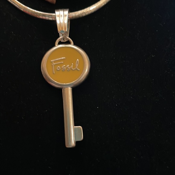 Fossil emblem re-purposed Sz 3.25 long 2 inches wide.  Yellow accent in middle. - Picture 7 of 8